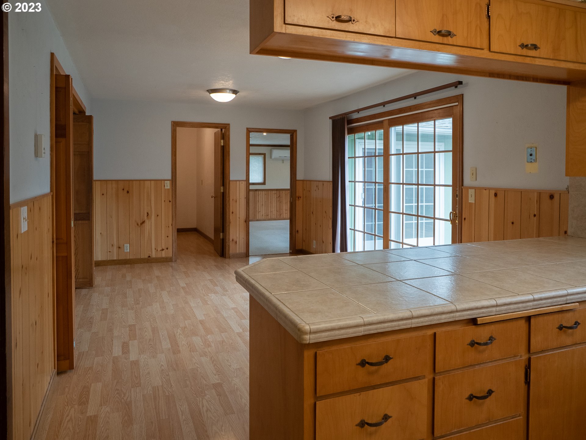 1124 President Street Eugene, OR 97401 - Photo 11 of 26 a view of a kitchen cabinets and wooden floor