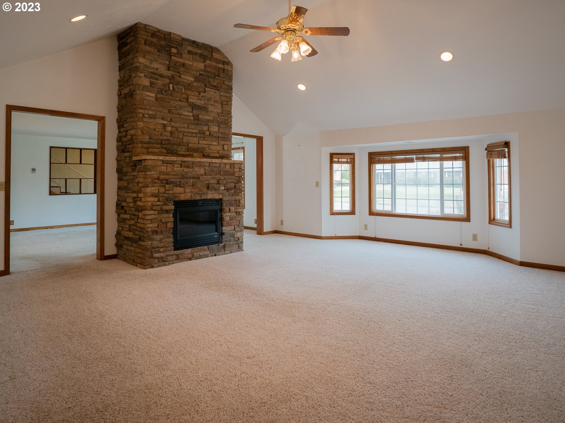 1124 President Street Eugene, OR 97401 - Photo 12 of 26 a view of a livingroom with a ceiling fan and window