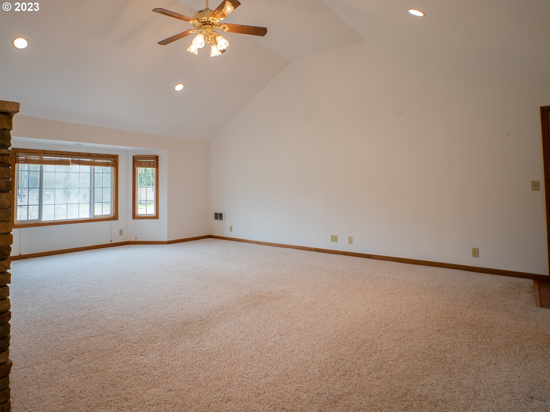 1124 President Street Eugene, OR 97401 - Photo 13 of 26 an empty room with a window and a ceiling fan