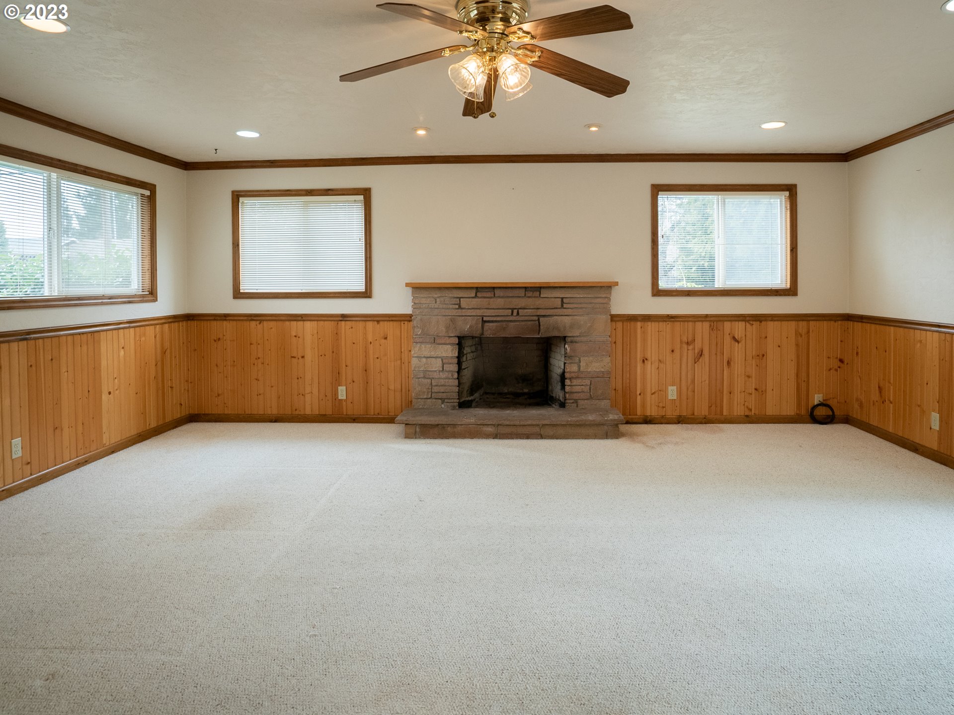 1124 President Street Eugene, OR 97401 - Photo 14 of 26 an empty room with windows and fireplace
