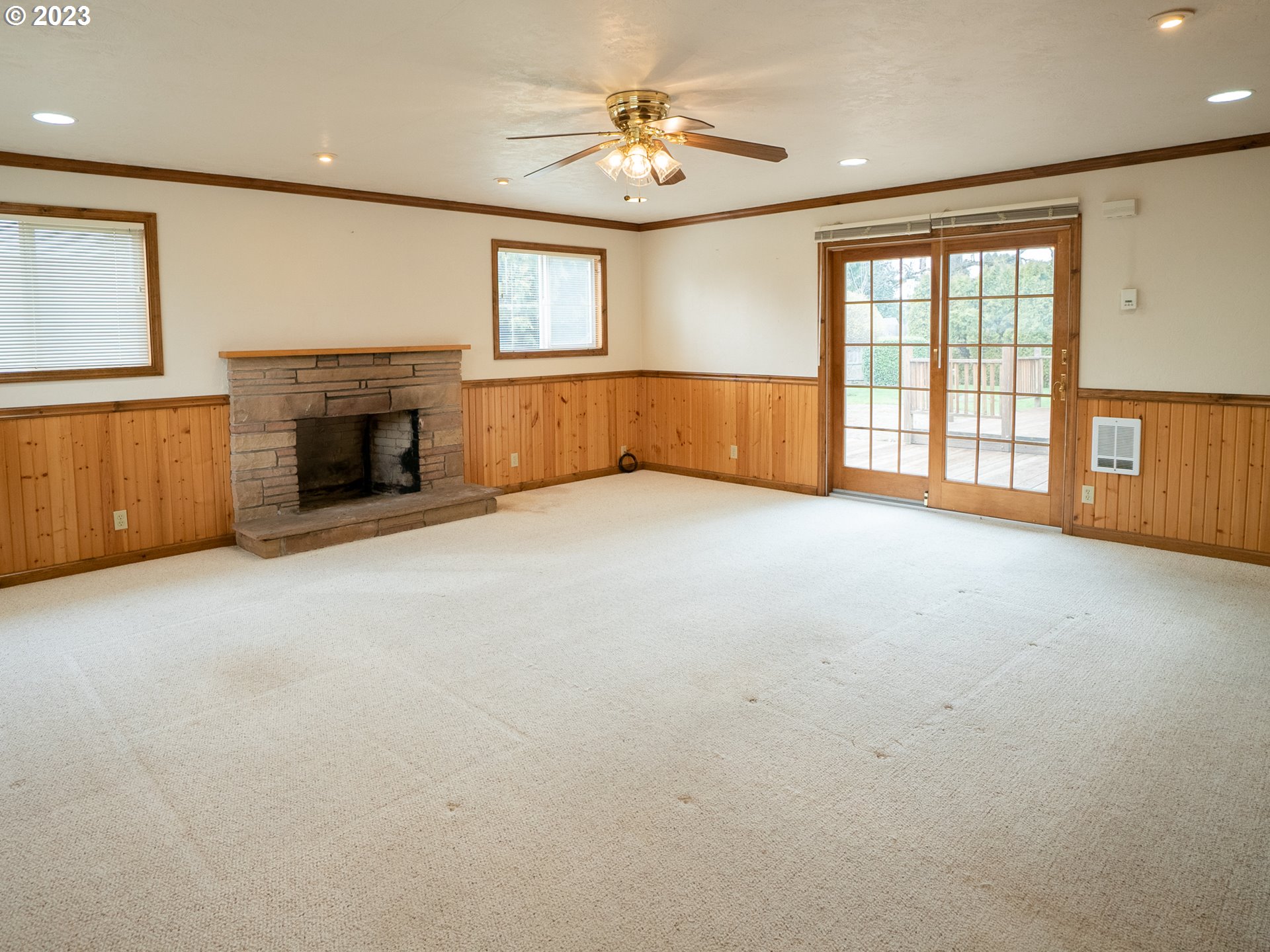 1124 President Street Eugene, OR 97401 - Photo 15 of 26 an empty room with windows and fireplace