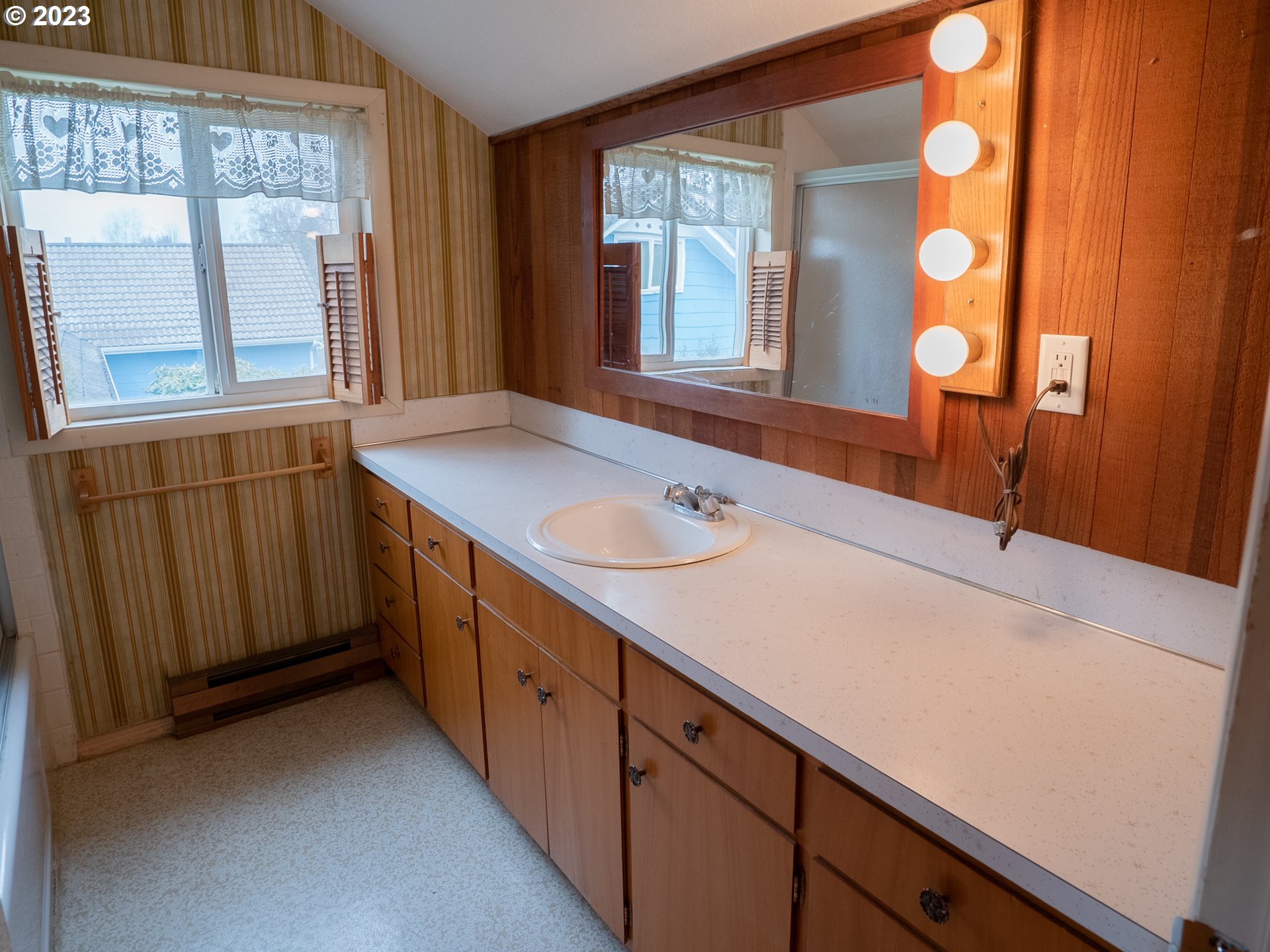 1124 President Street Eugene, OR 97401 - Photo 19 of 26 a bathroom with a sink and a mirror
