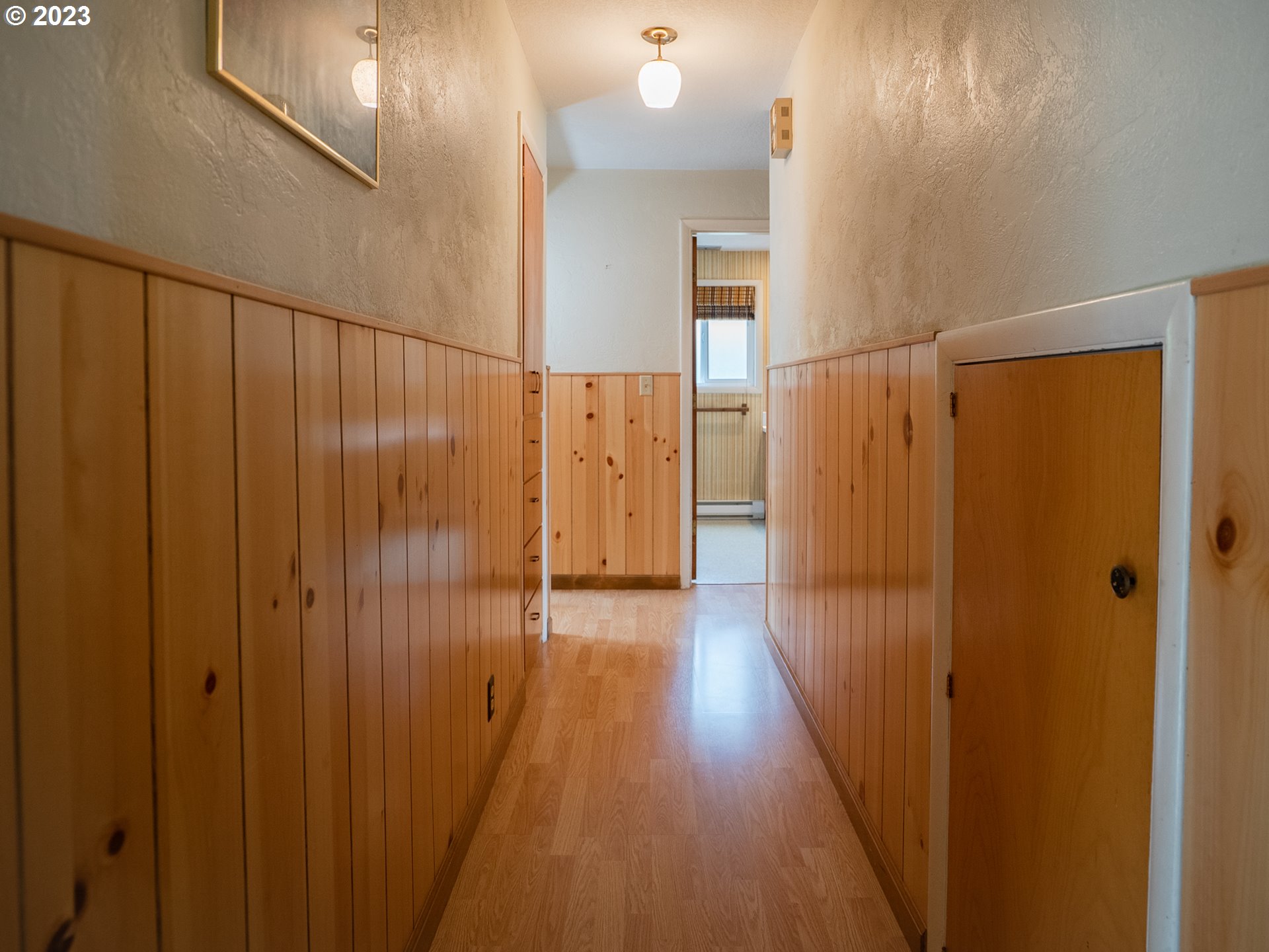 1124 President Street Eugene, OR 97401 - Photo 21 of 26 a view of a hallway with wooden floor