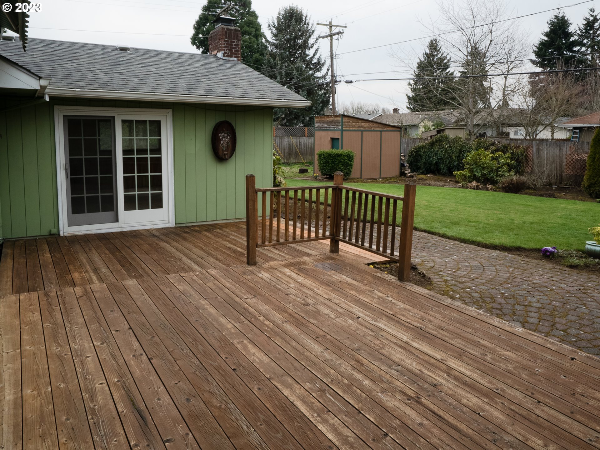 1124 President Street Eugene, OR 97401 - Photo 23 of 26 a view of backyard with deck and garden