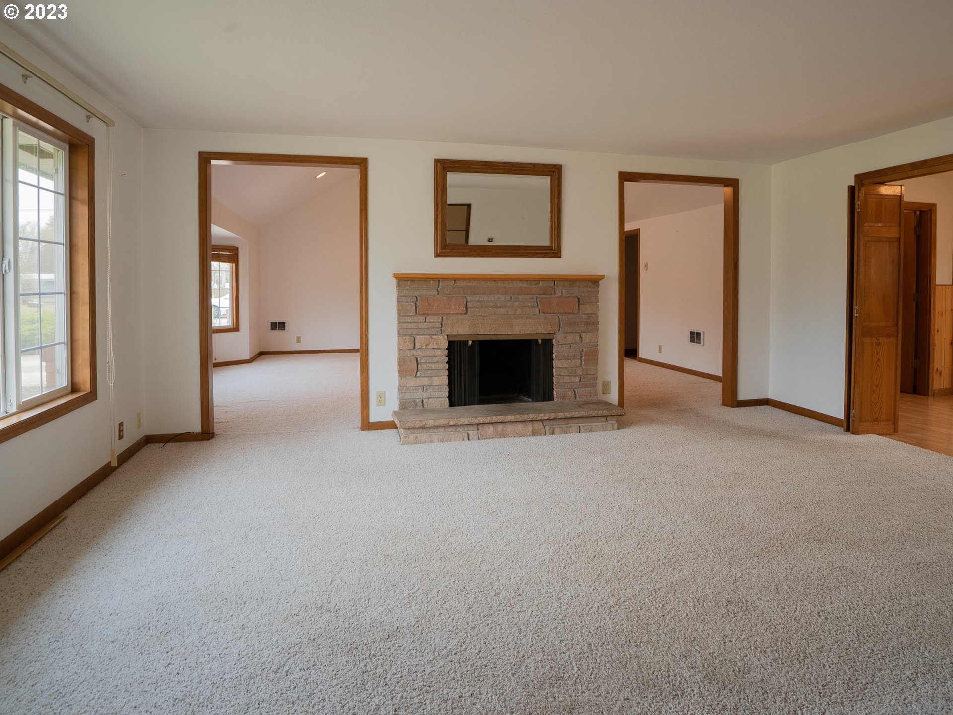 1124 President Street Eugene, OR 97401 - Photo 5 of 26 a view of empty room with window and fireplace