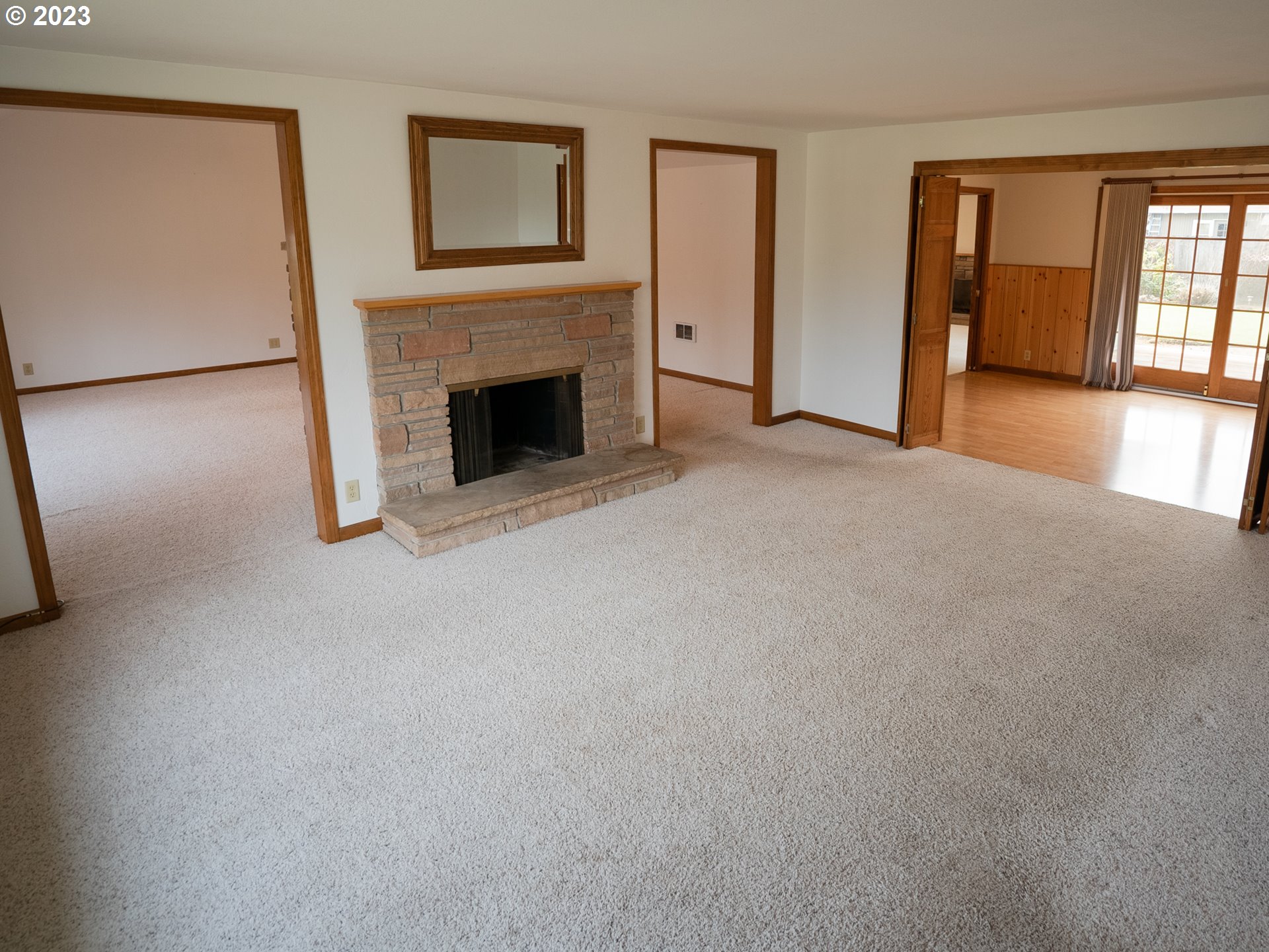 1124 President Street Eugene, OR 97401 - Photo 6 of 26 a view of a livingroom with an empty space and a fireplace