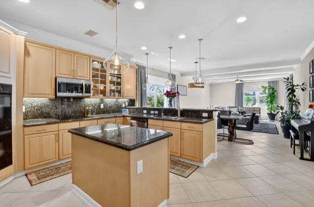 a kitchen with sink cabinets and window