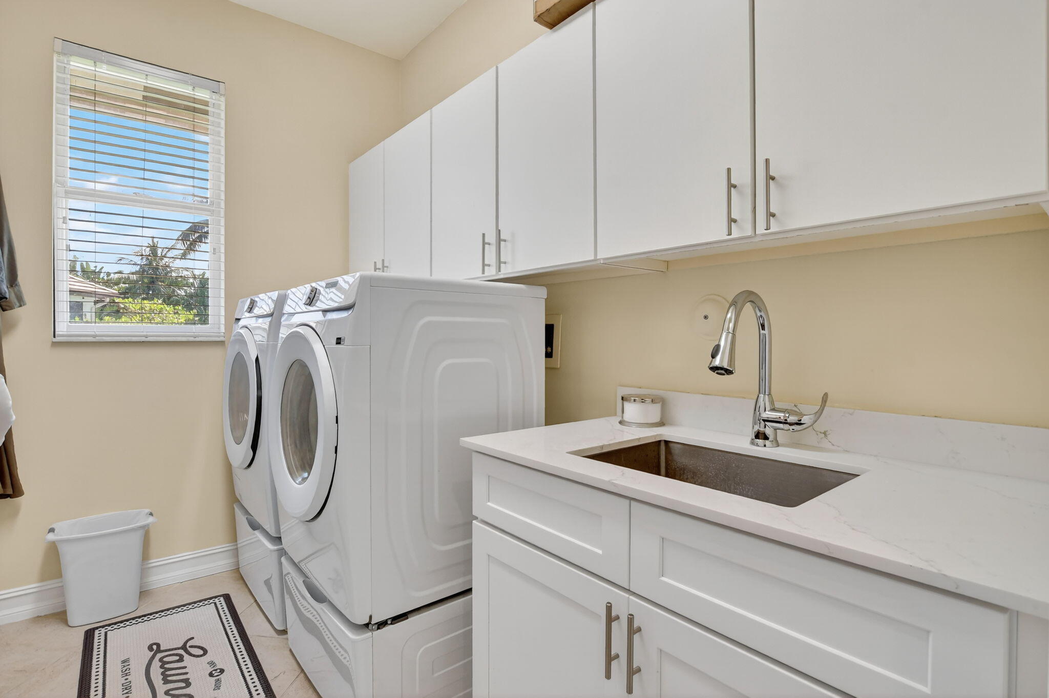 21383 Falls Ridge Way, Unit 1 Boca Raton, FL 33428 - Photo 17 of 44 a utility room with sink dryer and washer