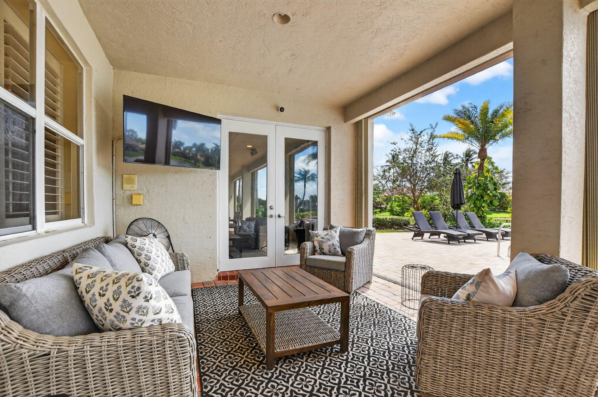 21383 Falls Ridge Way, Unit 1 Boca Raton, FL 33428 - Photo 30 of 44 a bedroom with furniture and a large window