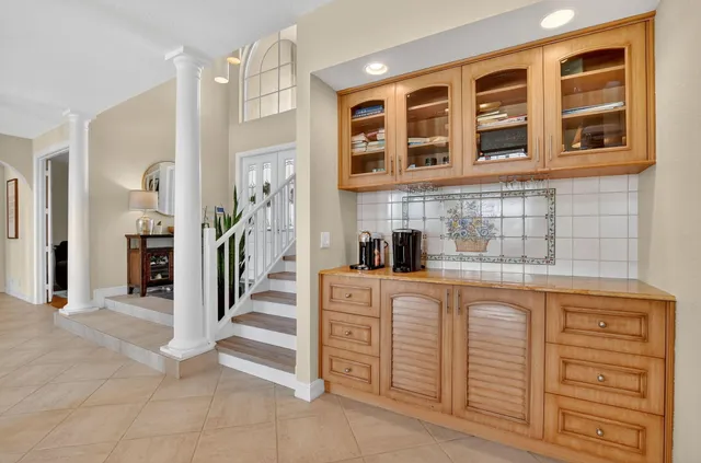 a kitchen with stainless steel appliances granite countertop a refrigerator and a sink