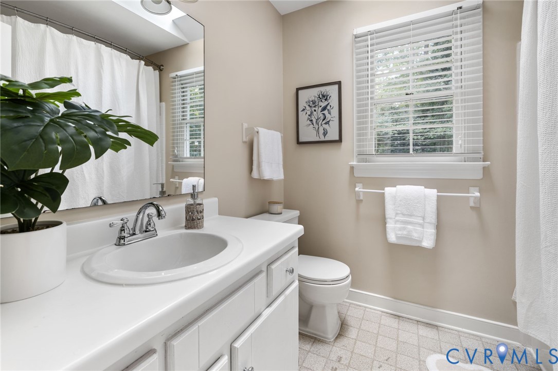 12825 Ashtree Road Midlothian, VA 23114 - Photo 17 of 22 a bathroom with a sink and a toilet