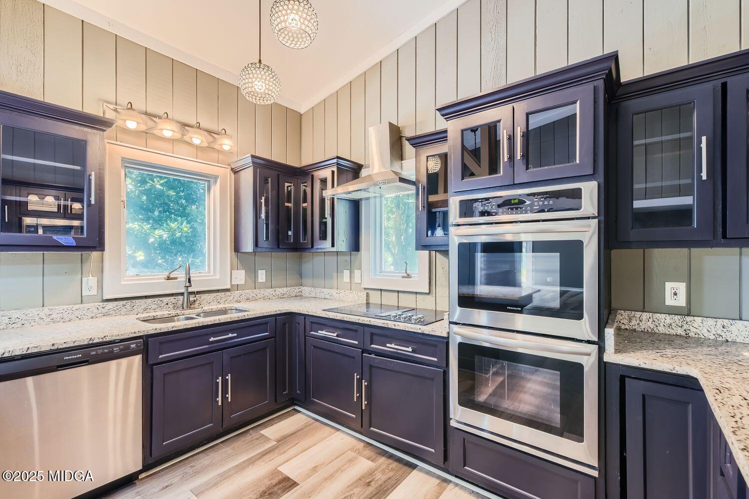 545 North Pine Hill Road Griffin, GA 30223 - Photo 11 of 39 a kitchen with stainless steel appliances granite countertop a sink and stove top oven
