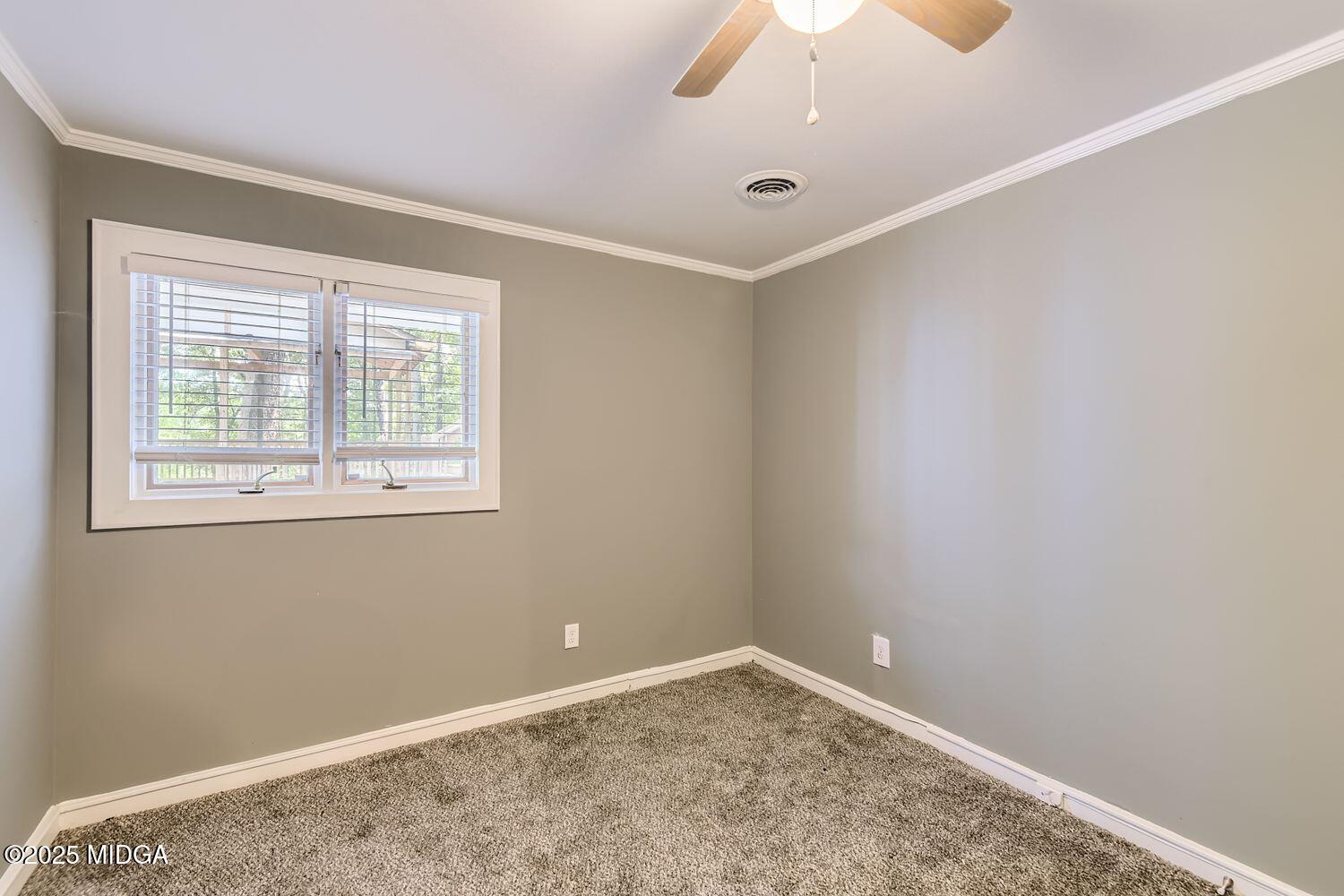 545 North Pine Hill Road Griffin, GA 30223 - Photo 22 of 39 an empty room with a window
