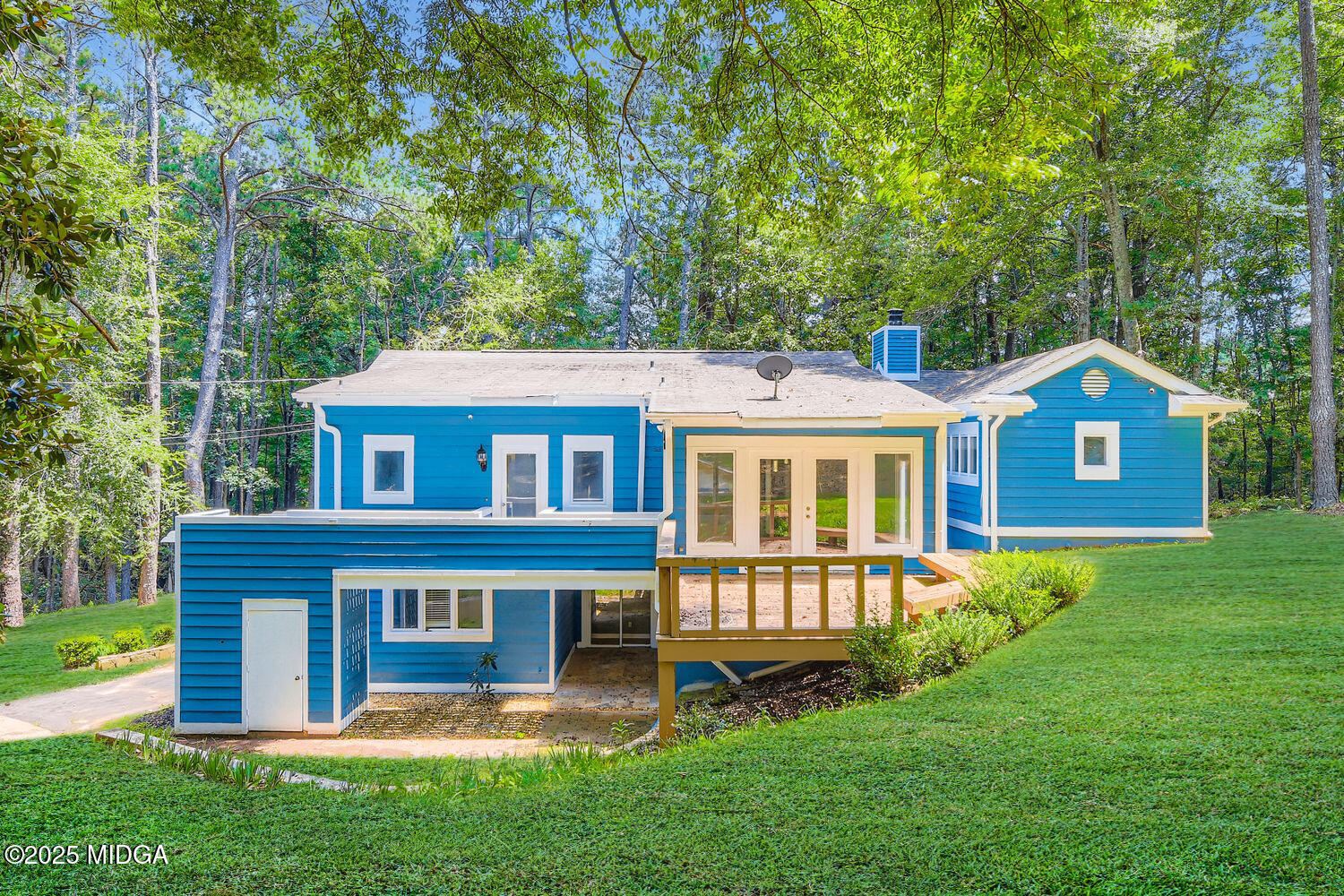 545 North Pine Hill Road Griffin, GA 30223 - Photo 29 of 39 a front view of a house with a garden and yard