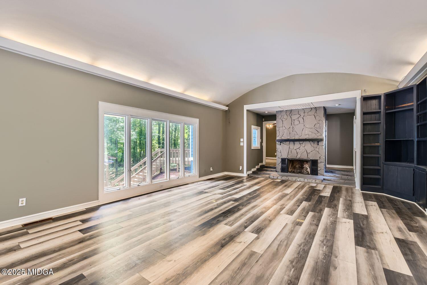 545 North Pine Hill Road Griffin, GA 30223 - Photo 6 of 39 a view of empty room with wooden floor and fan