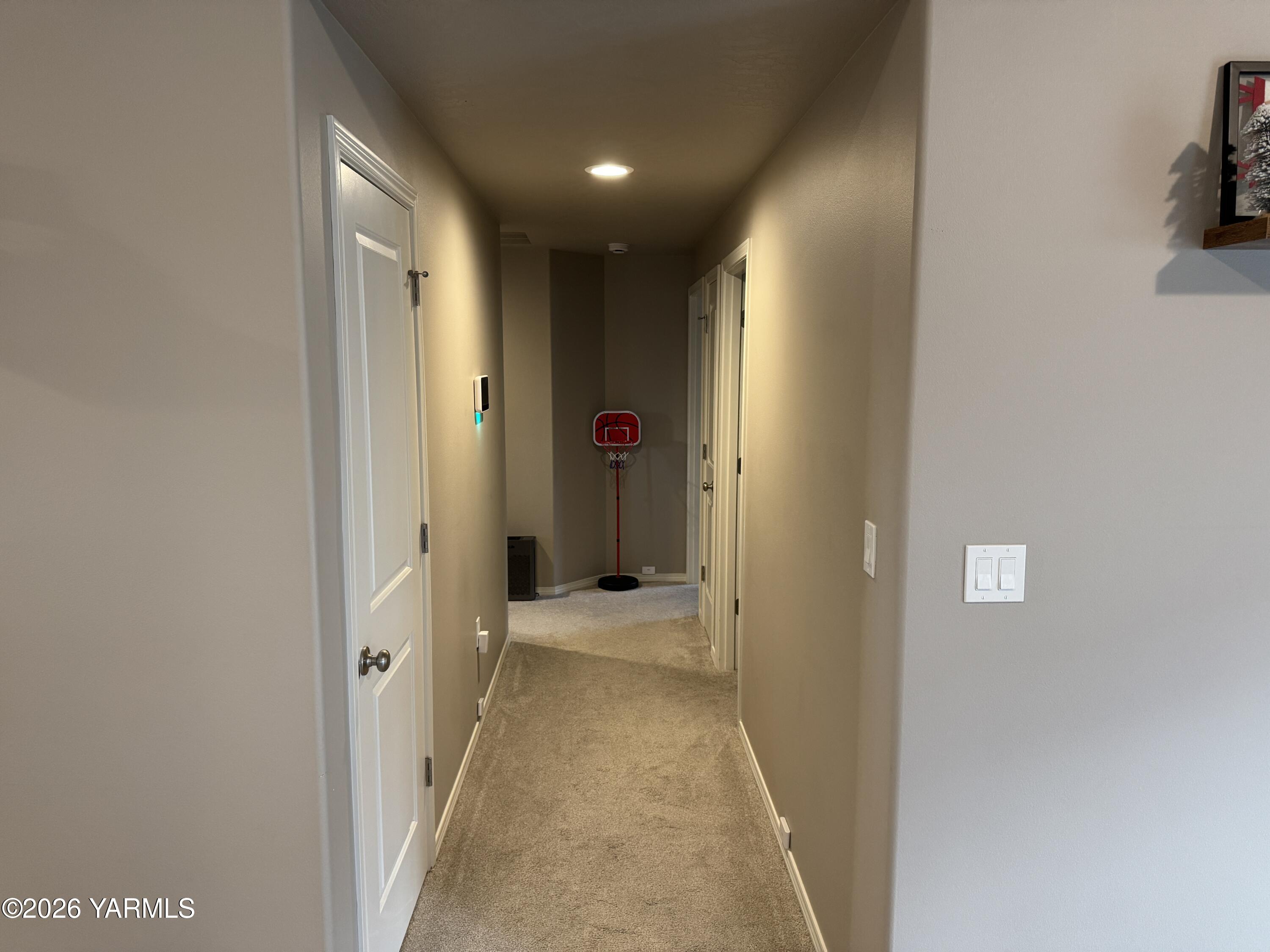 6104 Whitman Avenue Yakima, WA 98903 - Photo 8 of 19 a view of a hallway with wooden shelves
