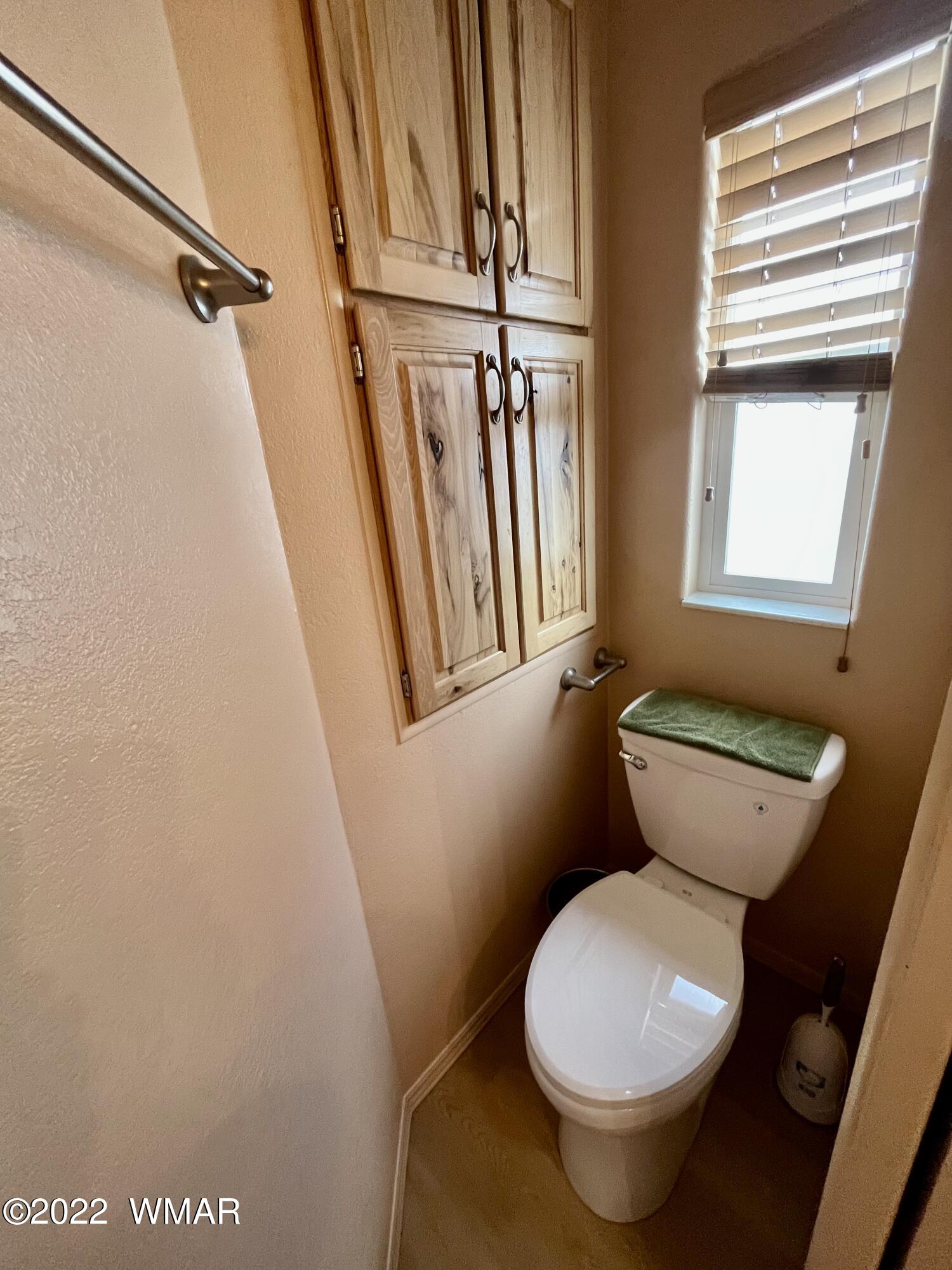 1860 Reel Way, Unit 471 Show Low, AZ 85901 - Photo 16 of 28 a bathroom with a toilet and a shower