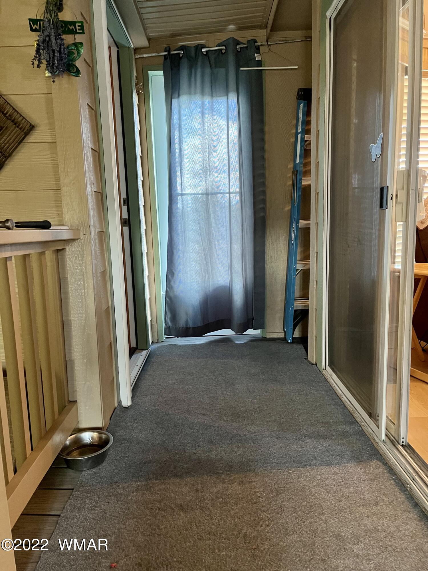 1860 Reel Way, Unit 471 Show Low, AZ 85901 - Photo 18 of 28 an empty room with a door