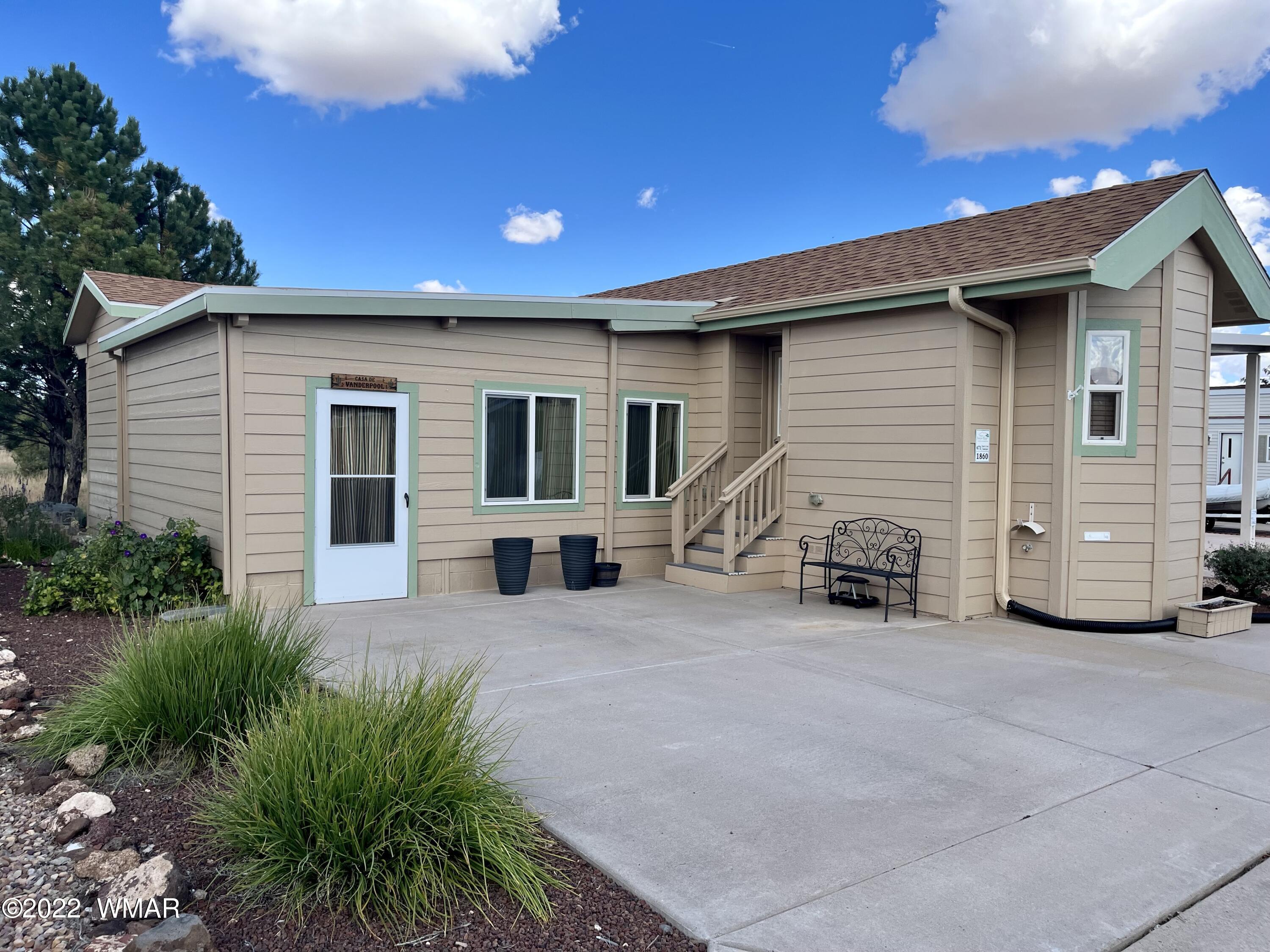 1860 Reel Way, Unit 471 Show Low, AZ 85901 - Photo 2 of 28 a view of a house with a patio
