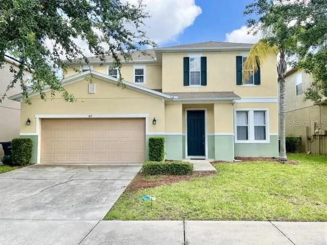 front view of a house with a yard