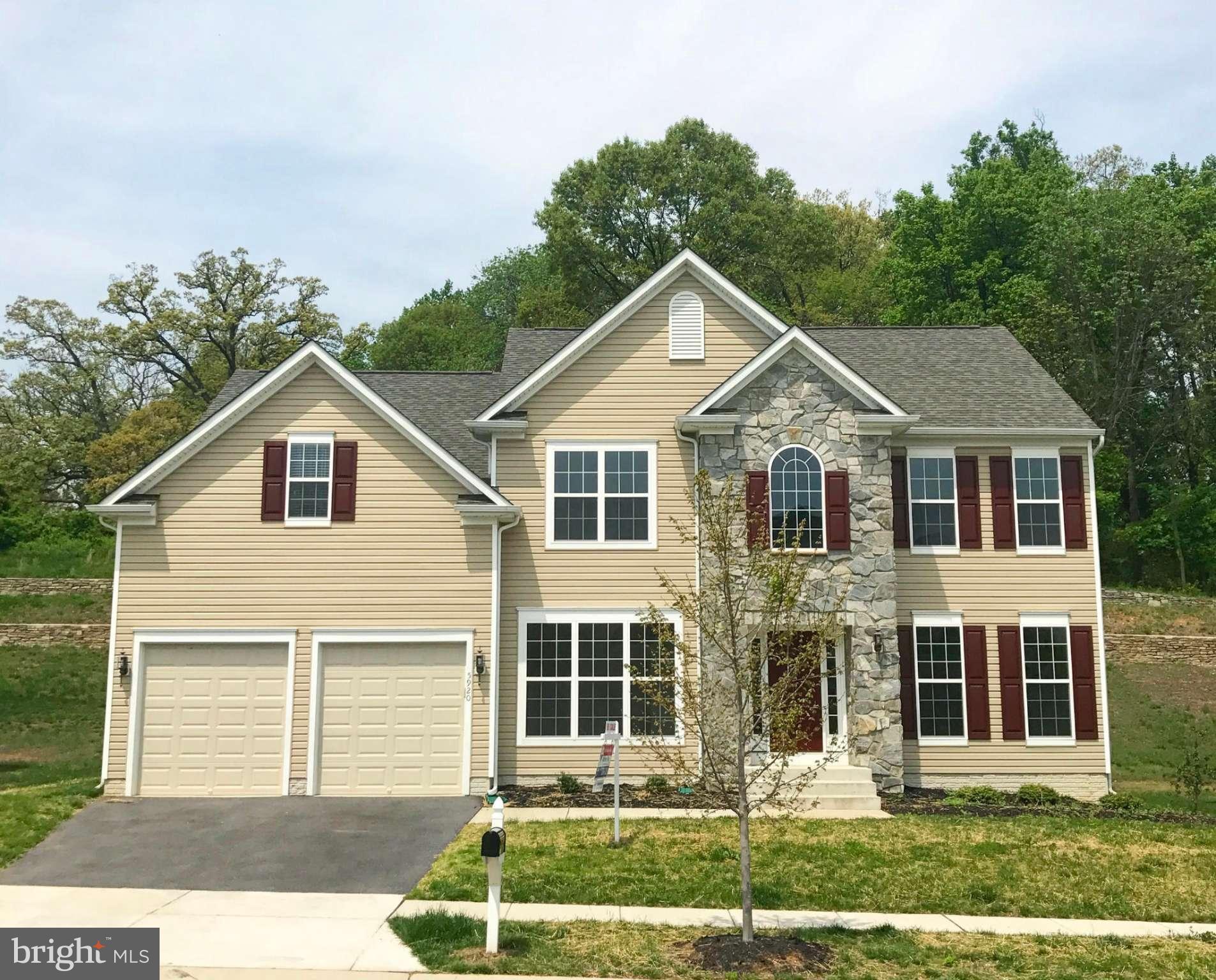 5920 Cypress Springs Road Elkridge, MD 21075 - Photo 1 of 28 a front view of a house with a yard