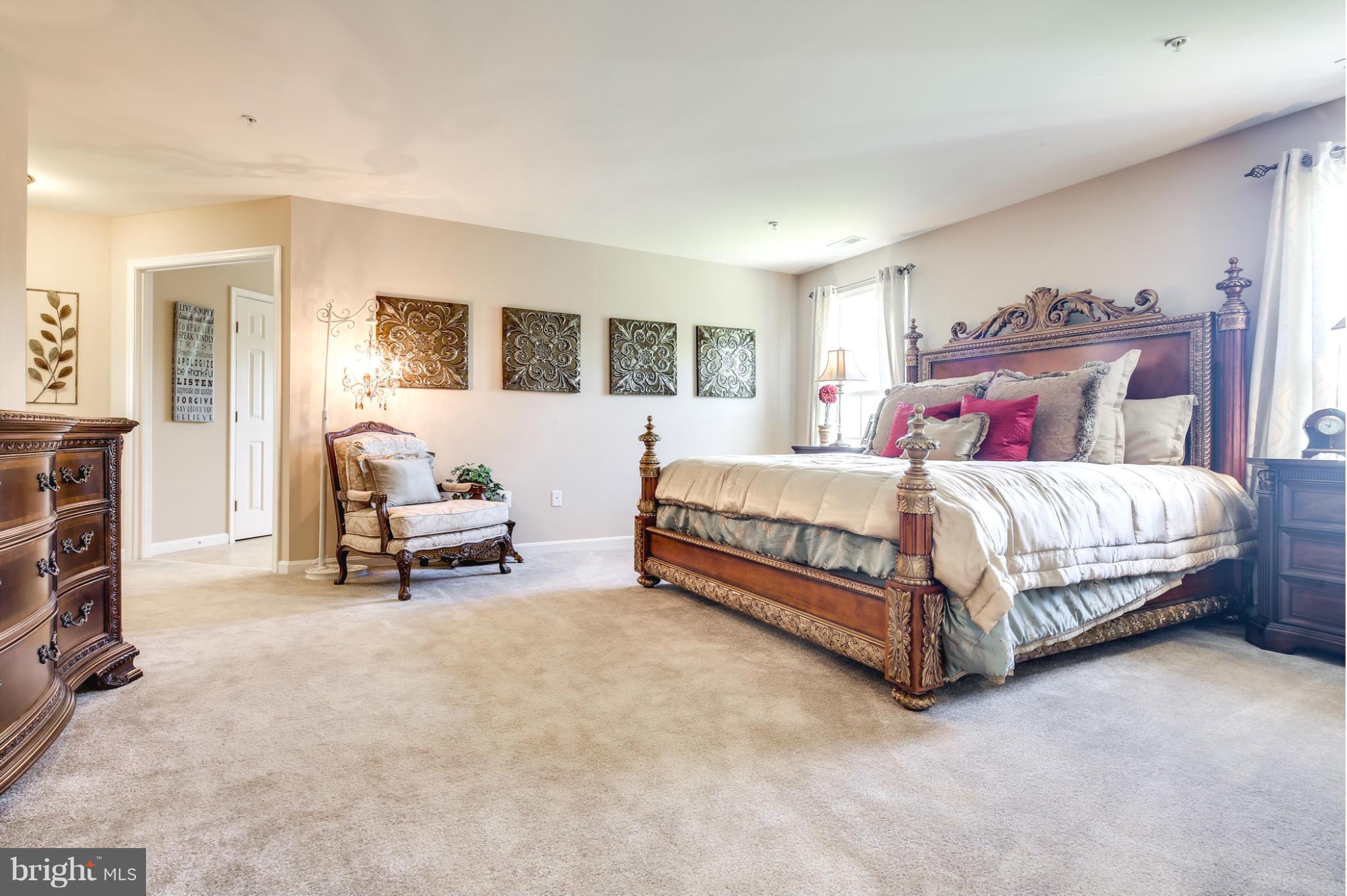 5920 Cypress Springs Road Elkridge, MD 21075 - Photo 18 of 28 a bedroom with a bed and a couch