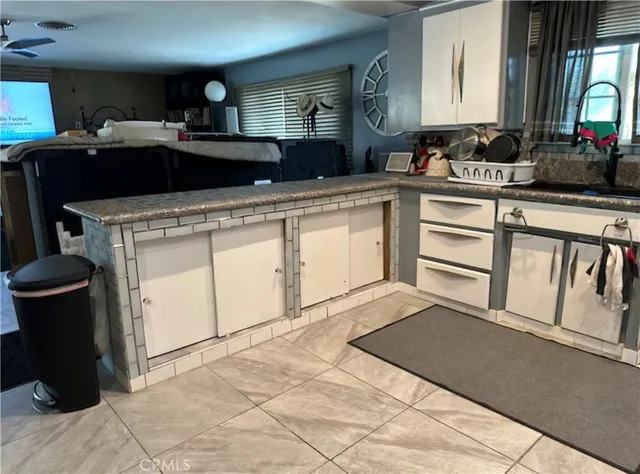 a kitchen with a sink and cabinets