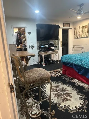 a kitchen with stainless steel appliances granite countertop a refrigerator and a stove