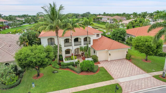an aerial view of residential houses with outdoor space and street view