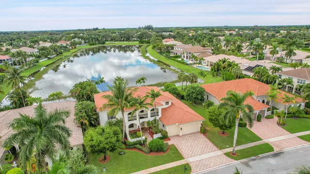 an aerial view of residential houses with outdoor space and street view