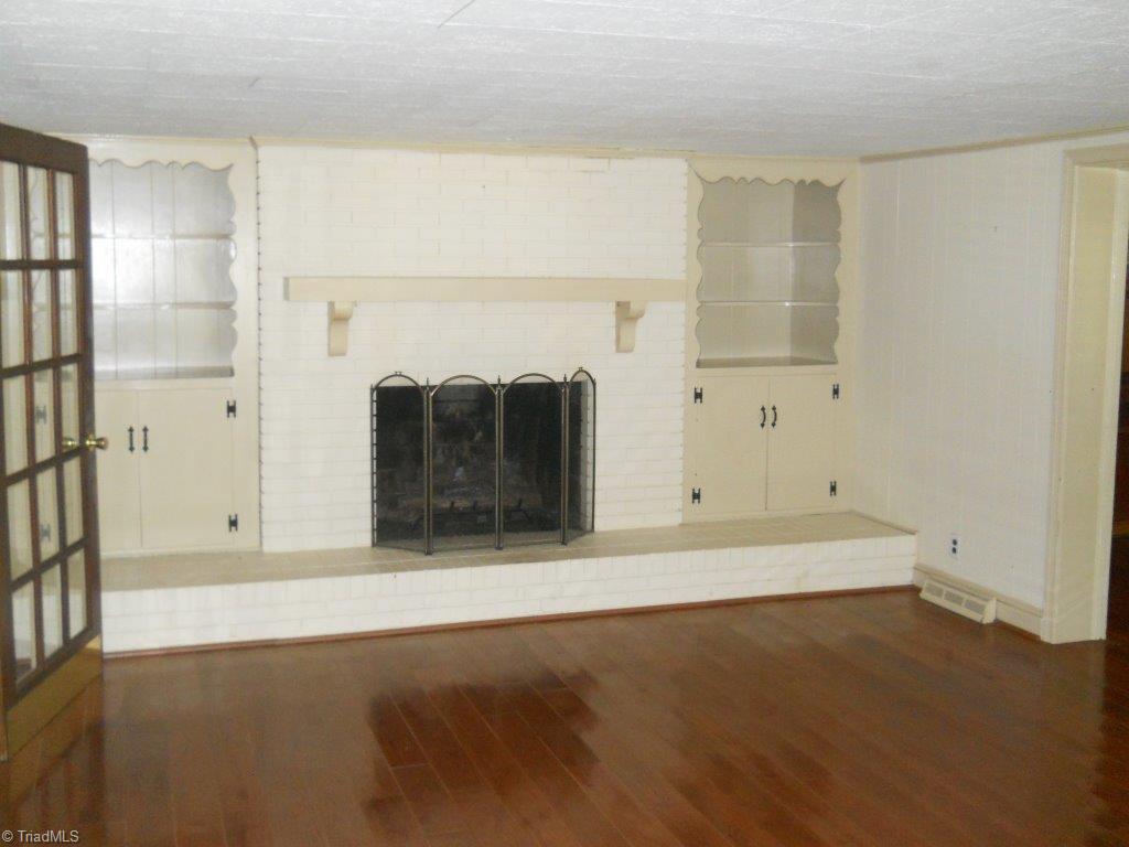 10261 Park Springs Road Ruffin, NC 27326 - Photo 16 of 26 Den with gas log fireplace.