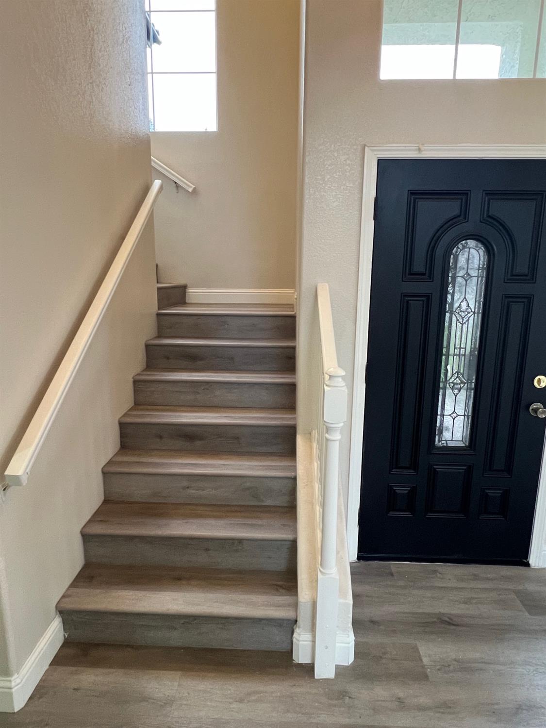 5930 West Birch Avenue Fresno, CA 93722 - Photo 15 of 32 a view of entryway and hall with wooden floor