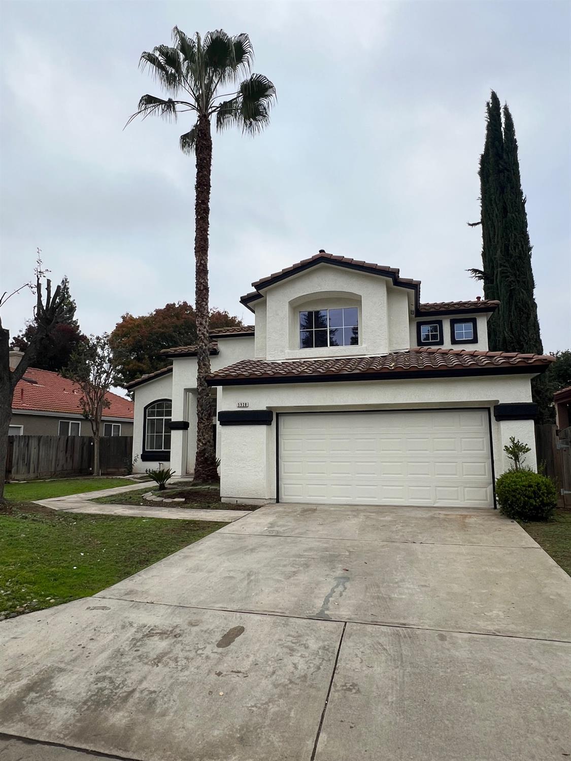 5930 West Birch Avenue Fresno, CA 93722 - Photo 2 of 32 a front view of a house with yard