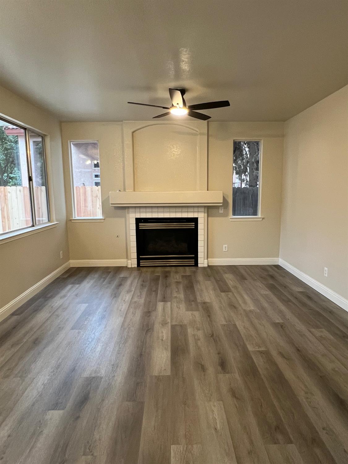 5930 West Birch Avenue Fresno, CA 93722 - Photo 28 of 32 a view of empty room with wooden floor and fan