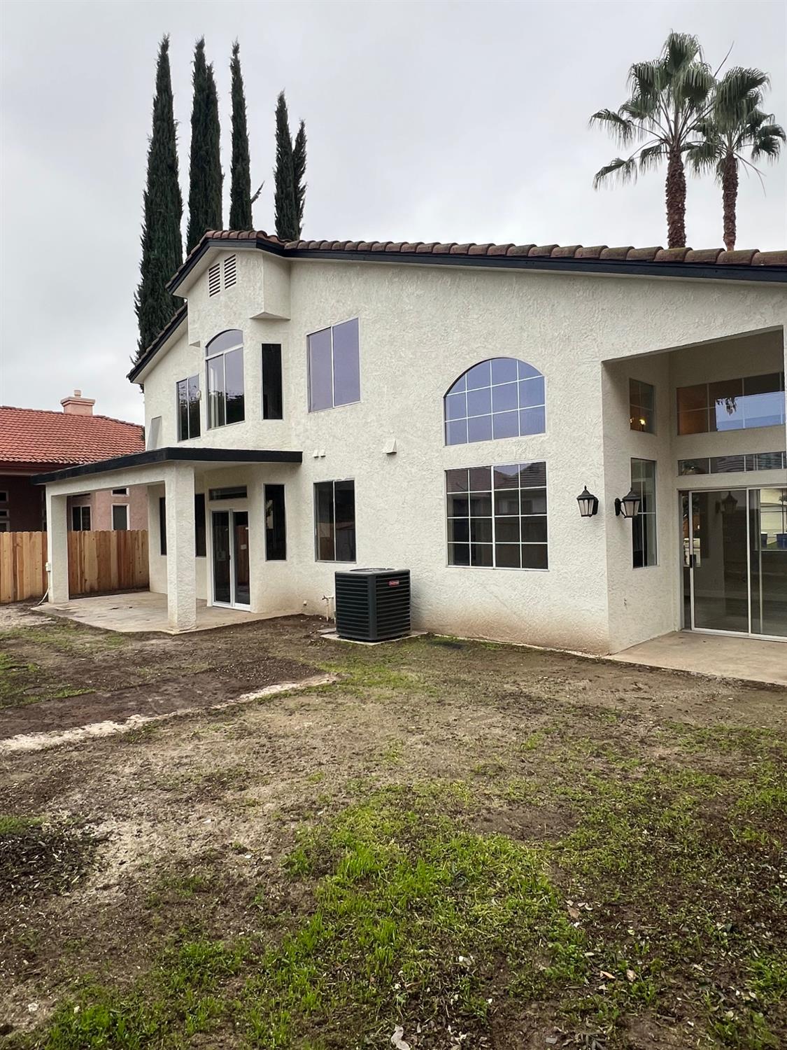 5930 West Birch Avenue Fresno, CA 93722 - Photo 29 of 32 a front view of a house with a garden
