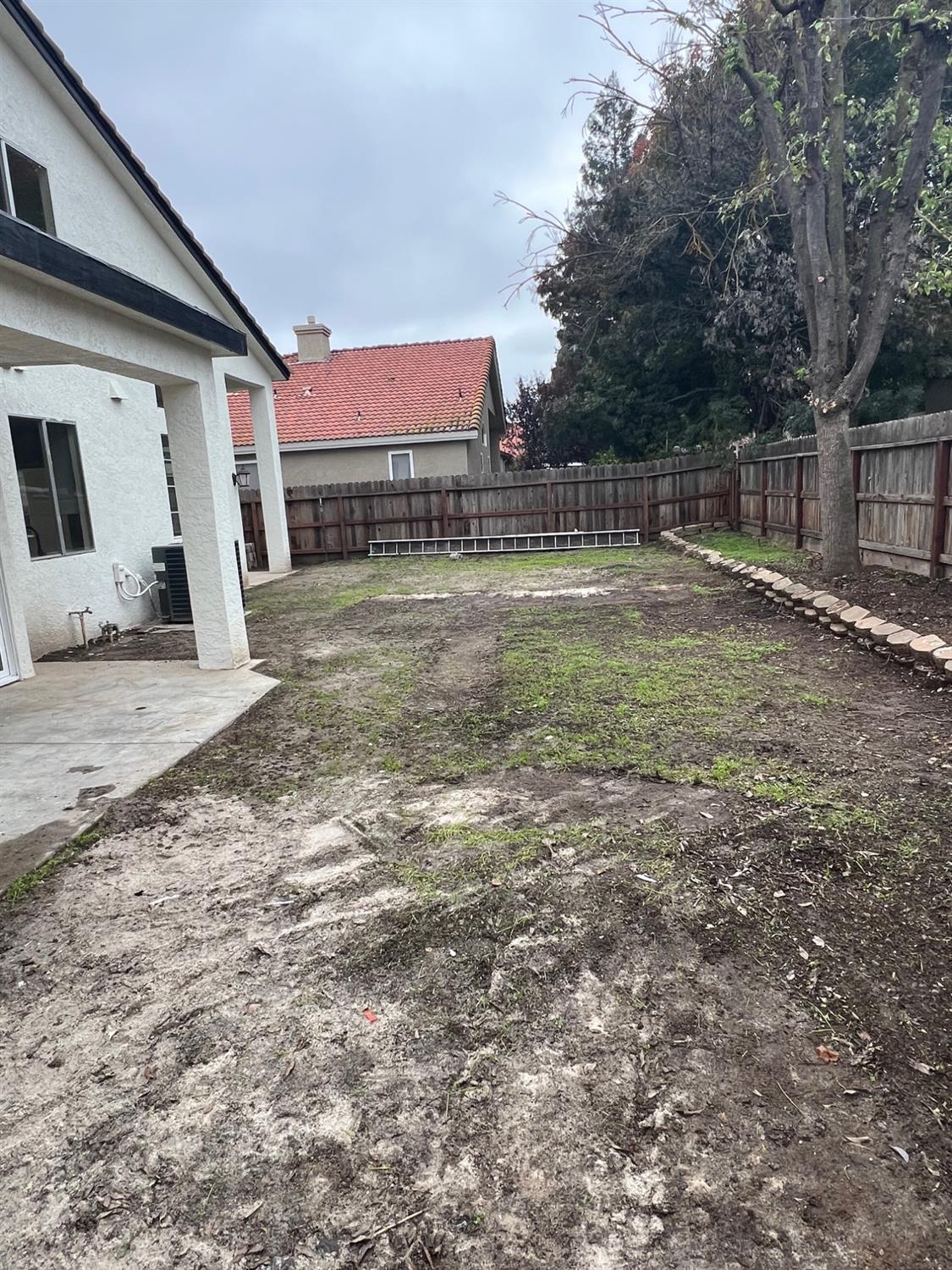 5930 West Birch Avenue Fresno, CA 93722 - Photo 32 of 32 a view of a back yard of the house