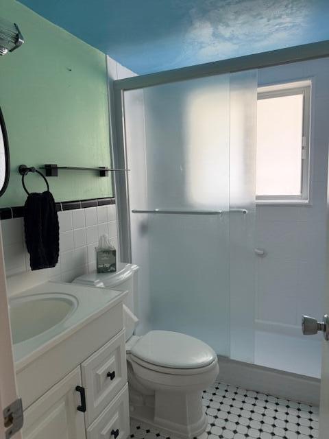 3402 Cynthia Lane, Unit 112 Lake Worth Beach, FL 33461 - Photo 12 of 41 a bathroom with a sink toilet and shower