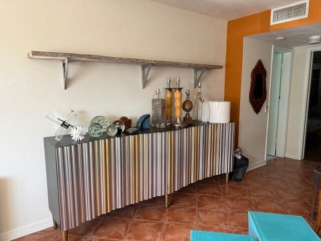 3402 Cynthia Lane, Unit 112 Lake Worth Beach, FL 33461 - Photo 21 of 41 a view of a balcony with furniture and floor to ceiling window