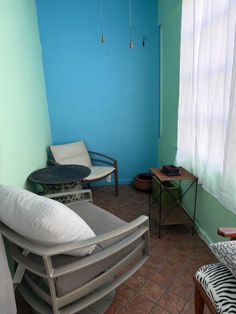 3402 Cynthia Lane, Unit 112 Lake Worth Beach, FL 33461 - Photo 23 of 41 a room with furniture and a window