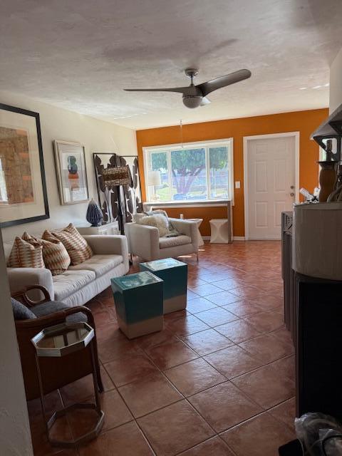 3402 Cynthia Lane, Unit 112 Lake Worth Beach, FL 33461 - Photo 27 of 41 a living room with fireplace furniture and a flat screen tv