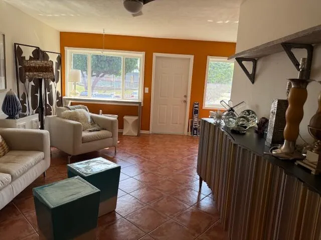 a living room with furniture and a window