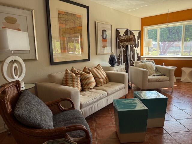 3402 Cynthia Lane, Unit 112 Lake Worth Beach, FL 33461 - Photo 3 of 41 a living room with furniture and a large window