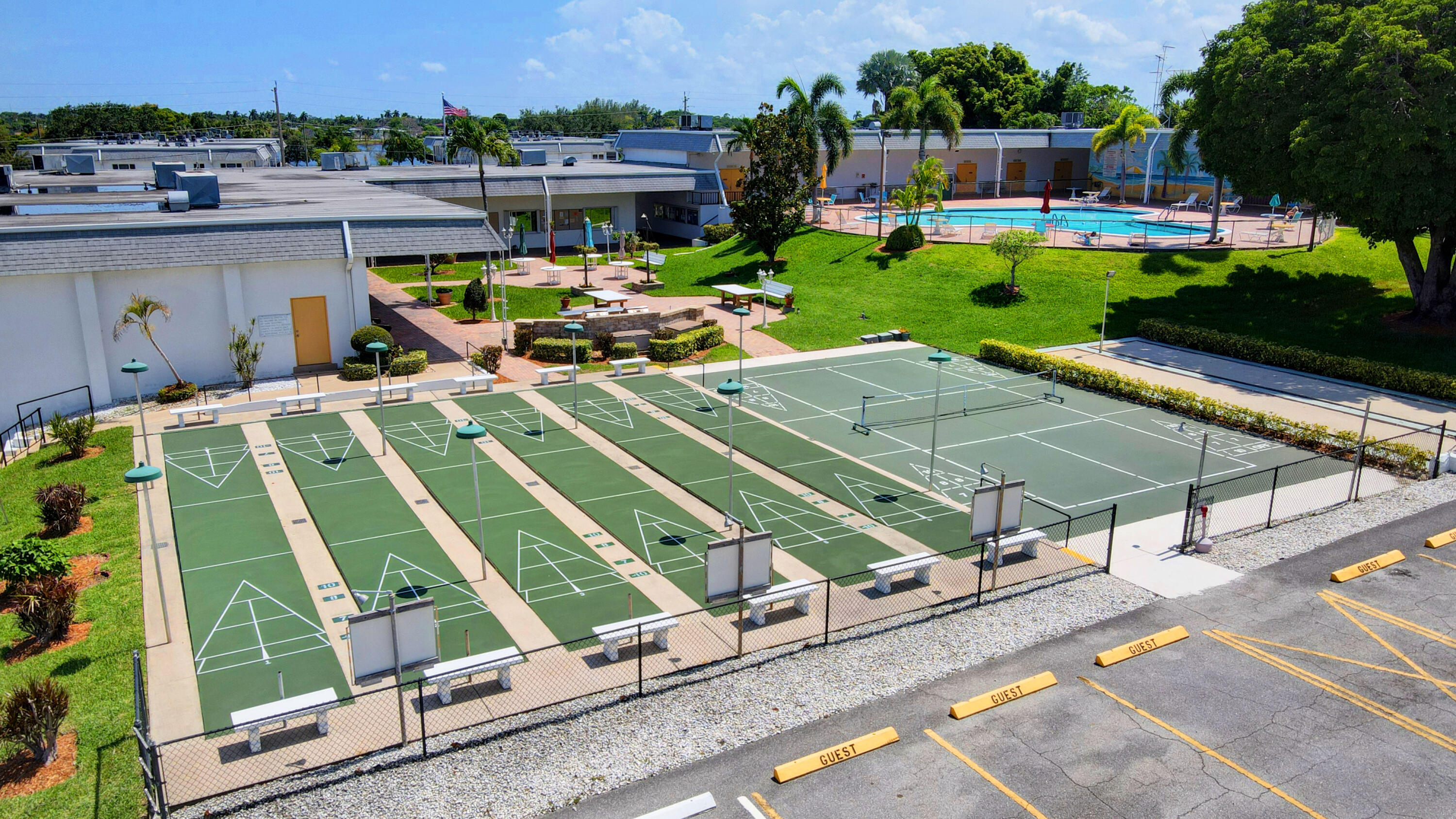 3402 Cynthia Lane, Unit 112 Lake Worth Beach, FL 33461 - Photo 36 of 41 an aerial view of a chairs and table on the terrace