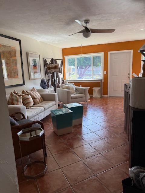 3402 Cynthia Lane, Unit 112 Lake Worth Beach, FL 33461 - Photo 6 of 41 a living room with furniture and a large window