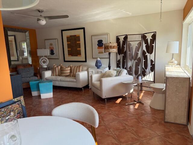 3402 Cynthia Lane, Unit 112 Lake Worth Beach, FL 33461 - Photo 7 of 41 a living room with furniture and a mirror