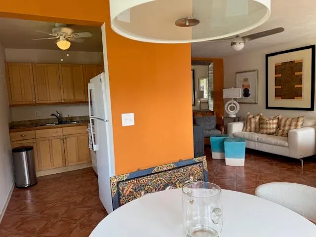 a kitchen with a sink appliances and cabinets