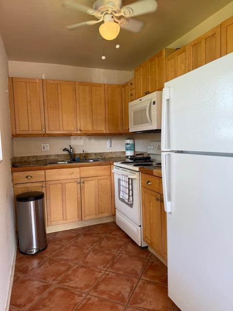 3402 Cynthia Lane, Unit 112 Lake Worth Beach, FL 33461 - Photo 10 of 41 a kitchen with white cabinets and white appliances