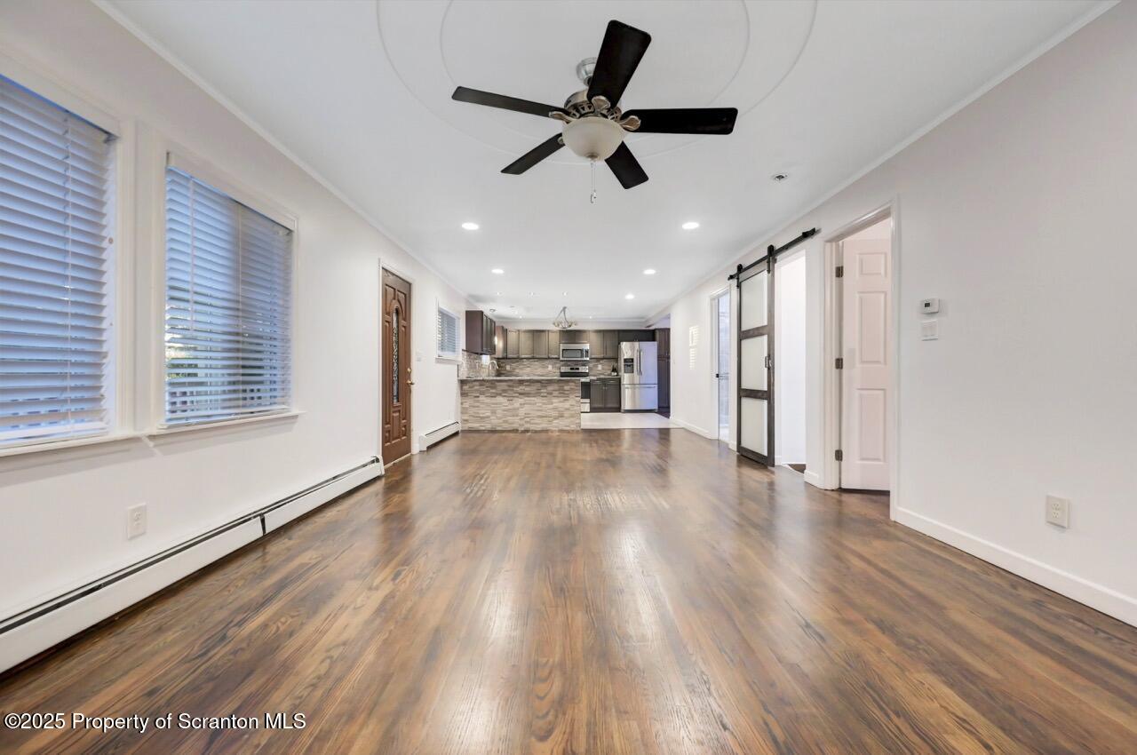 1427 Birch Street Scranton, PA 18505 - Photo 11 of 55 a view of empty room with wooden floor and ceiling fan