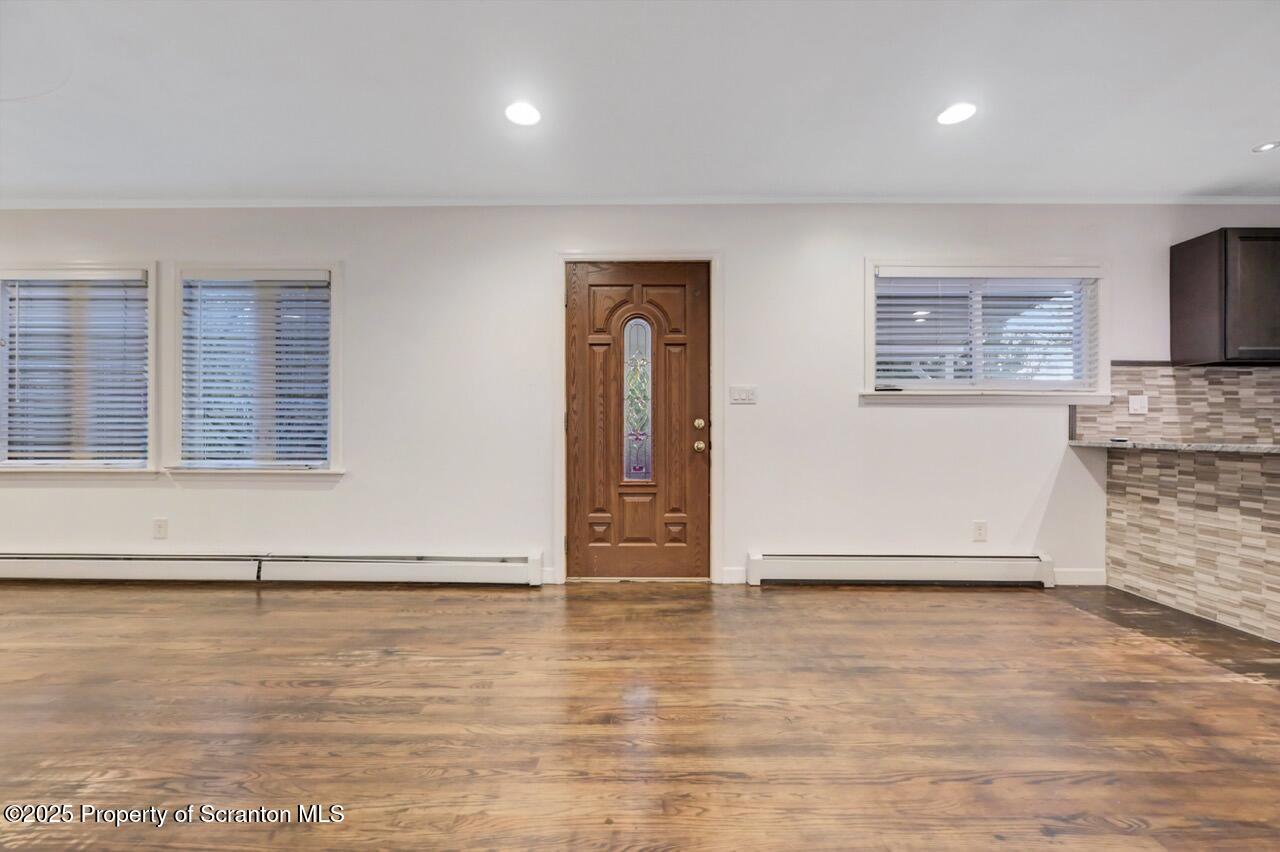 1427 Birch Street Scranton, PA 18505 - Photo 12 of 55 an empty room with wooden floor and windows