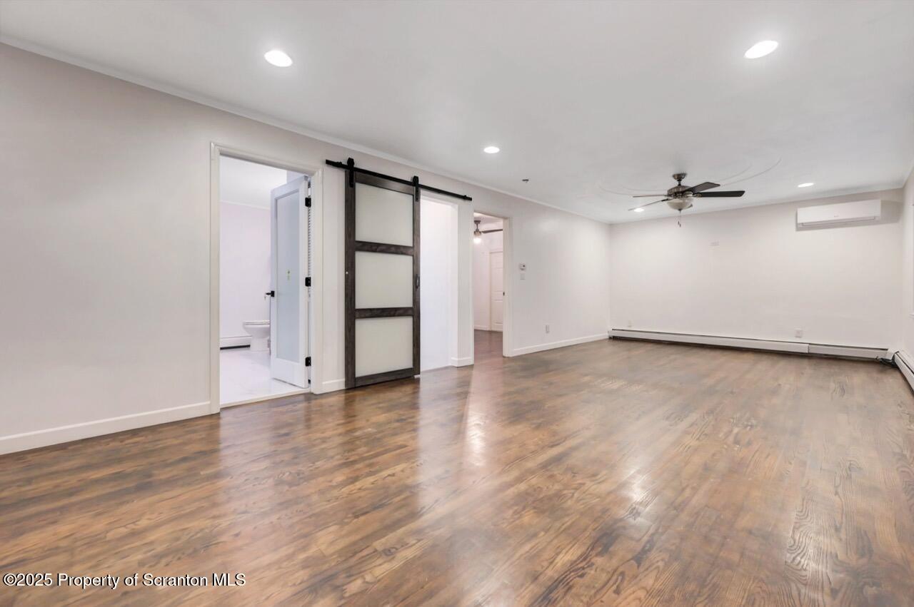 1427 Birch Street Scranton, PA 18505 - Photo 13 of 55 an empty room with wooden floor closet and windows